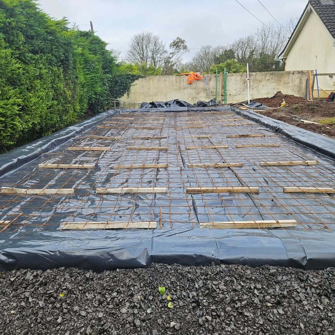 Damp-proof membrane and steel reinforcement mesh ready ahead of a concrete pour